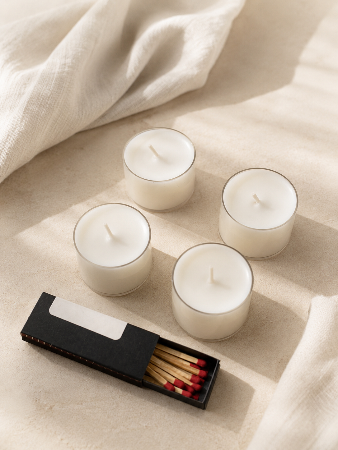 4 velas de té (8h\und) + cerillas